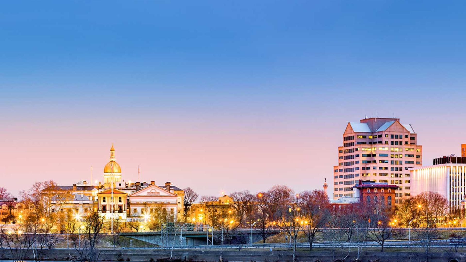 View of downtown buildings lighted up at dawn